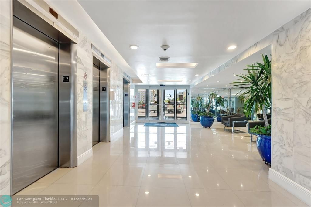 1600 South Ocean Drive, Unit 18B Hollywood, FL 33019 - Photo 24 of 36 a view of a hallway with dining area and chandelier