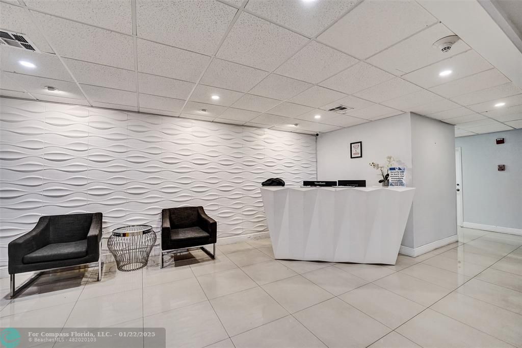 1600 South Ocean Drive, Unit 18B Hollywood, FL 33019 - Photo 28 of 36 a hallway with a white cabinets and white appliances