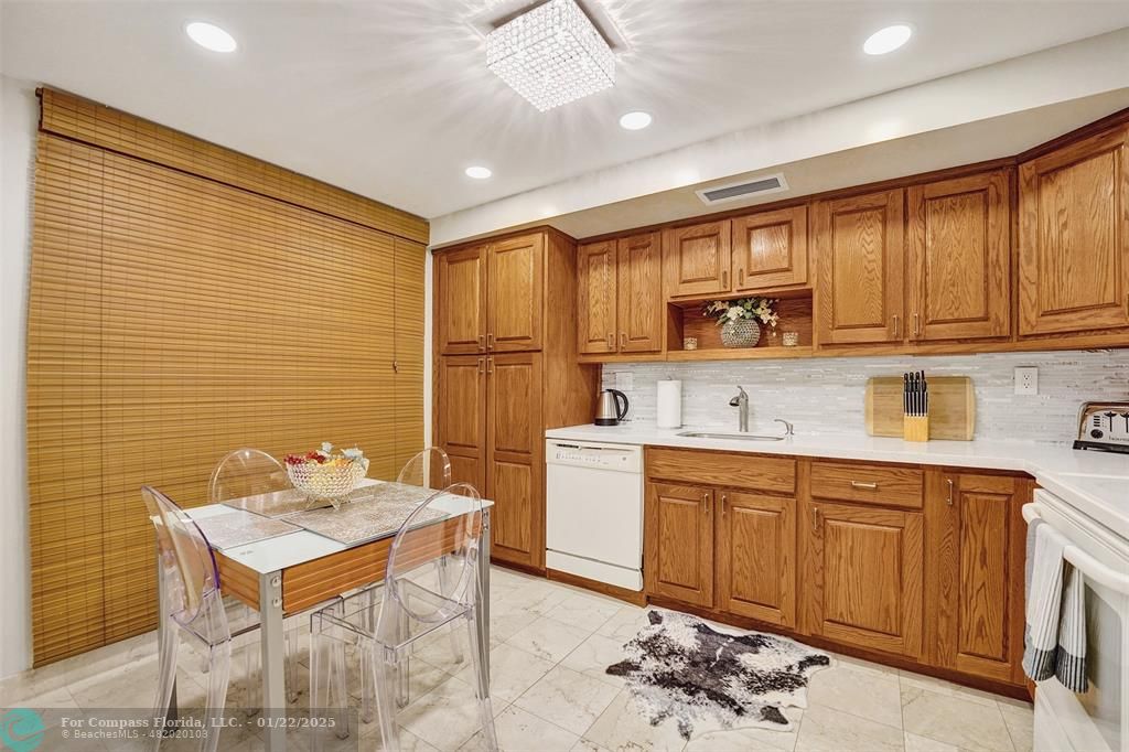 1600 South Ocean Drive, Unit 18B Hollywood, FL 33019 - Photo 9 of 36 a kitchen with a sink cabinets and window