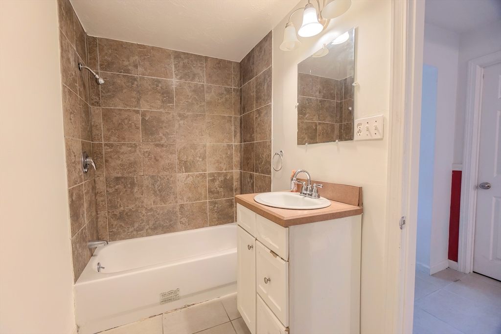 201 Stone Street Clinton, MA 01510 - Photo 23 of 42 a bathroom with a sink and a mirror