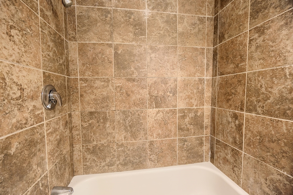 201 Stone Street Clinton, MA 01510 - Photo 24 of 42 a bathroom with a bathtub