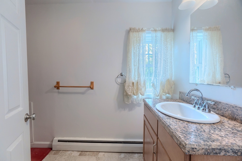 201 Stone Street Clinton, MA 01510 - Photo 35 of 42 a bathroom with a sink and a mirror