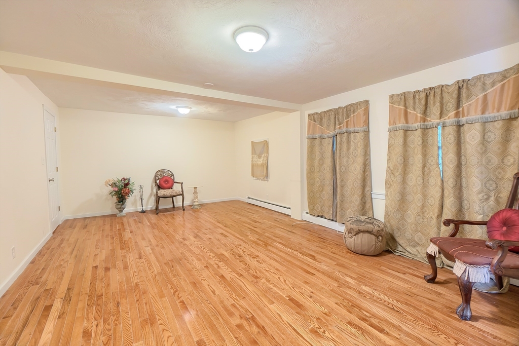 201 Stone Street Clinton, MA 01510 - Photo 5 of 42 a view of empty room with wooden floor