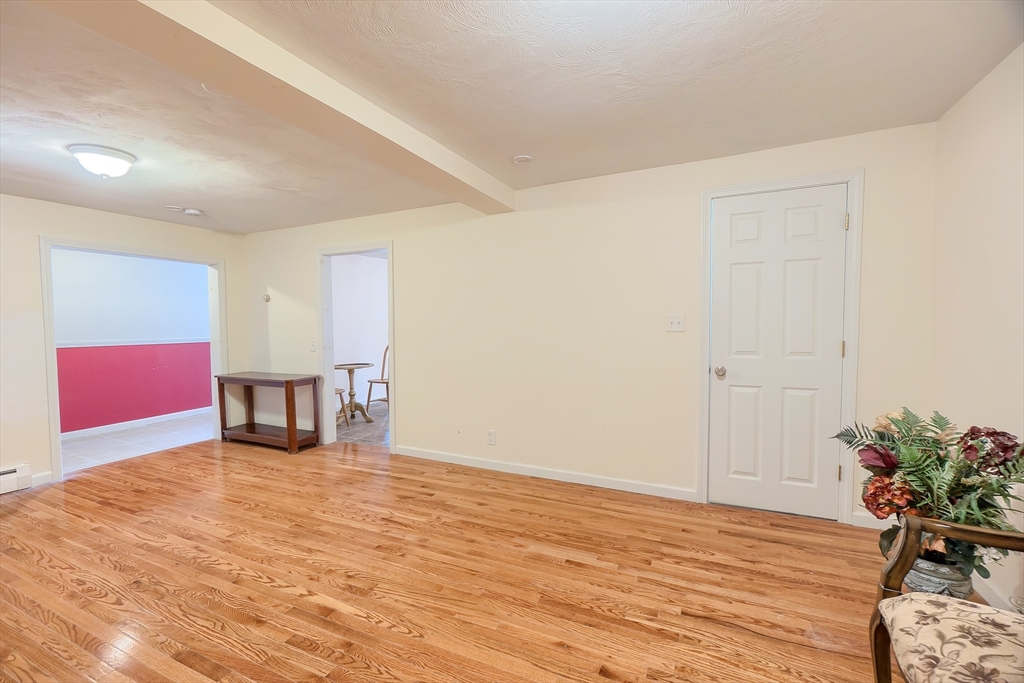 201 Stone Street Clinton, MA 01510 - Photo 9 of 42 a view of an empty room with wooden floor