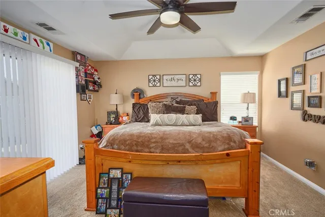 a bathroom with a granite countertop toilet sink and mirror