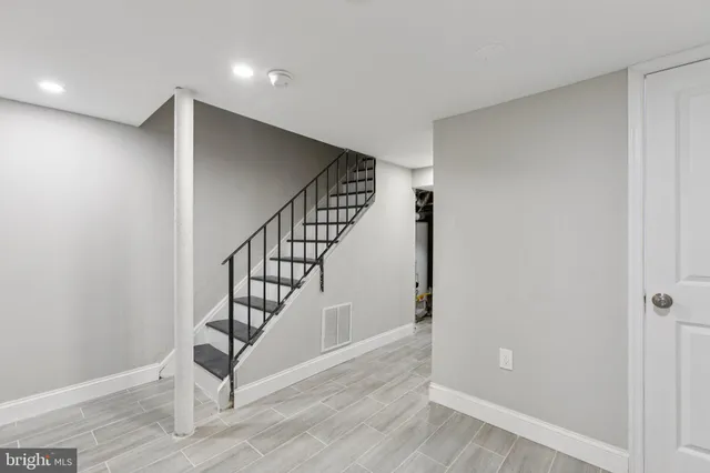 a view of an entryway with wooden floor