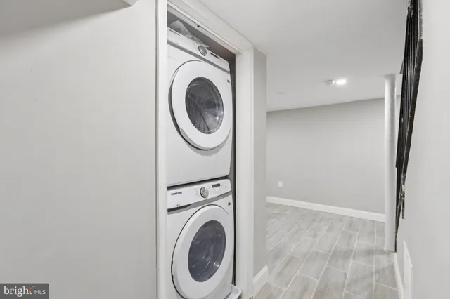 a view of a hallway with washer and dryer