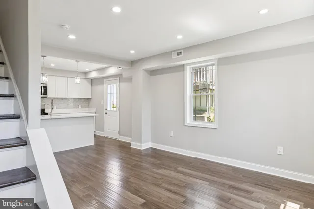 a view of kitchen with wooden floor