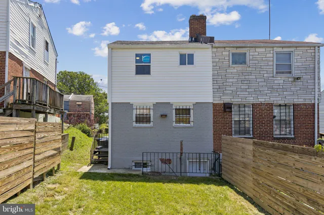 a spacious bathroom with a double vanity sink and a mirror