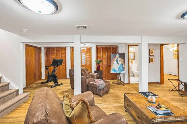 a view of a livingroom with furniture and floor to ceiling window