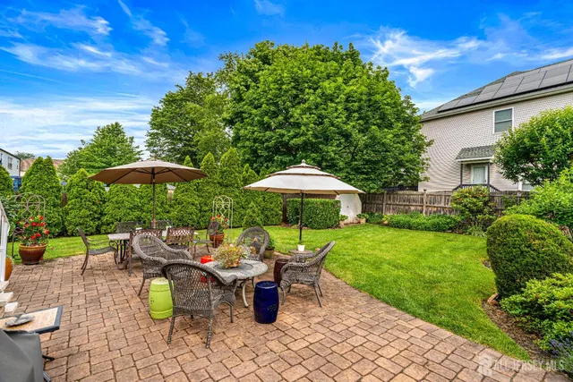 a view of a table and chairs under an umbrella in patio