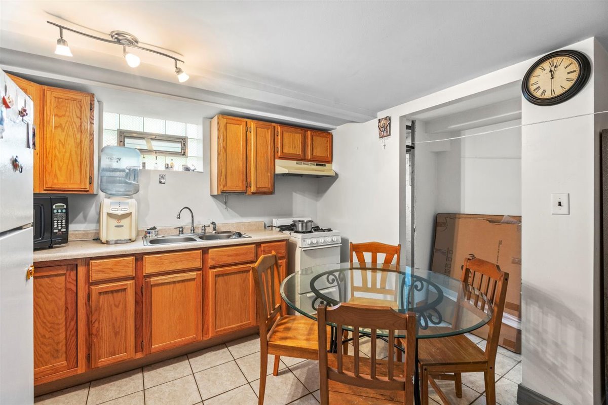 10619 Mason Avenue Chicago Ridge, IL 60415 - Photo 22 of 29 a view of a kitchen area with furniture and wooden floor