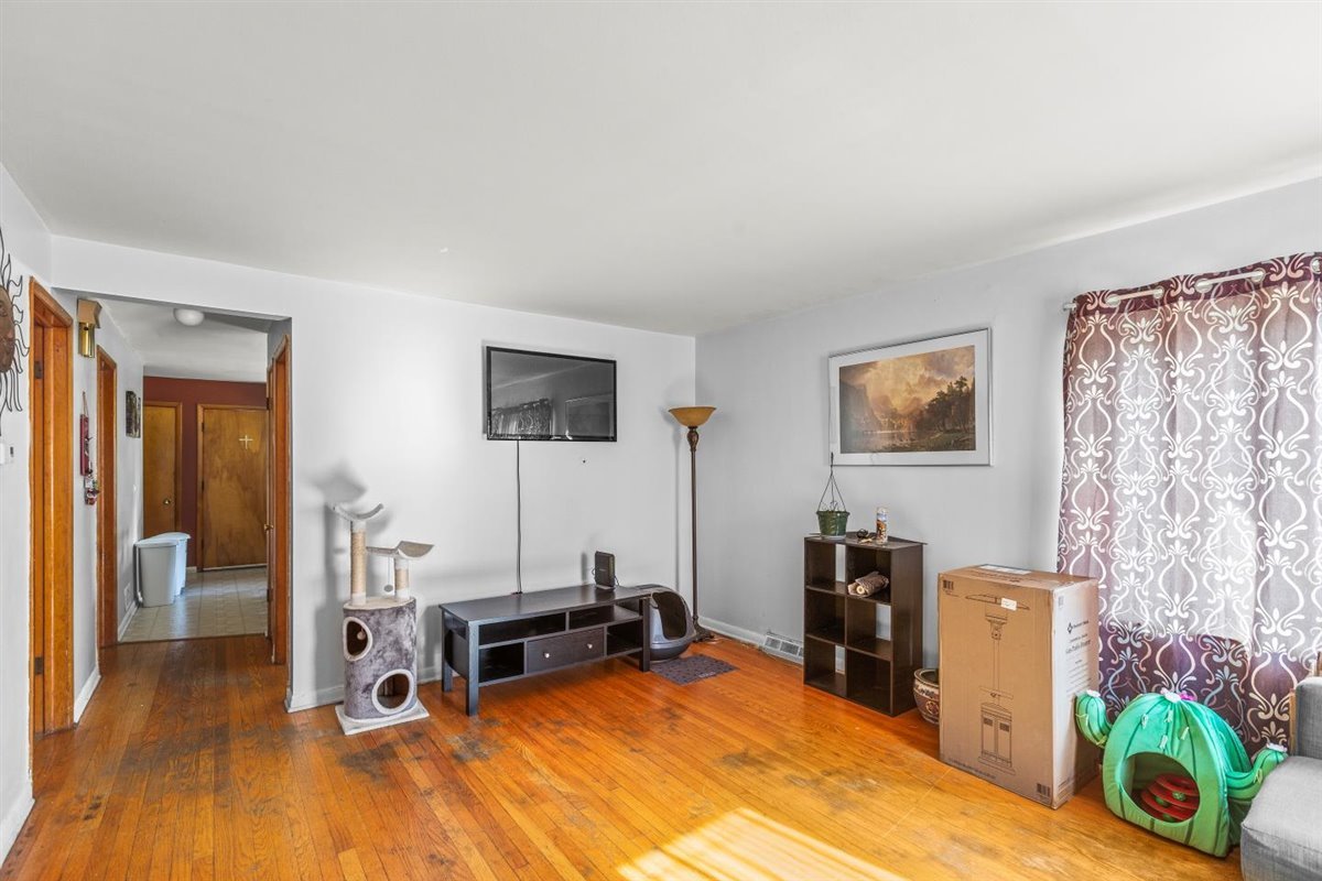 10619 Mason Avenue Chicago Ridge, IL 60415 - Photo 4 of 29 a room with furniture and a wooden floor