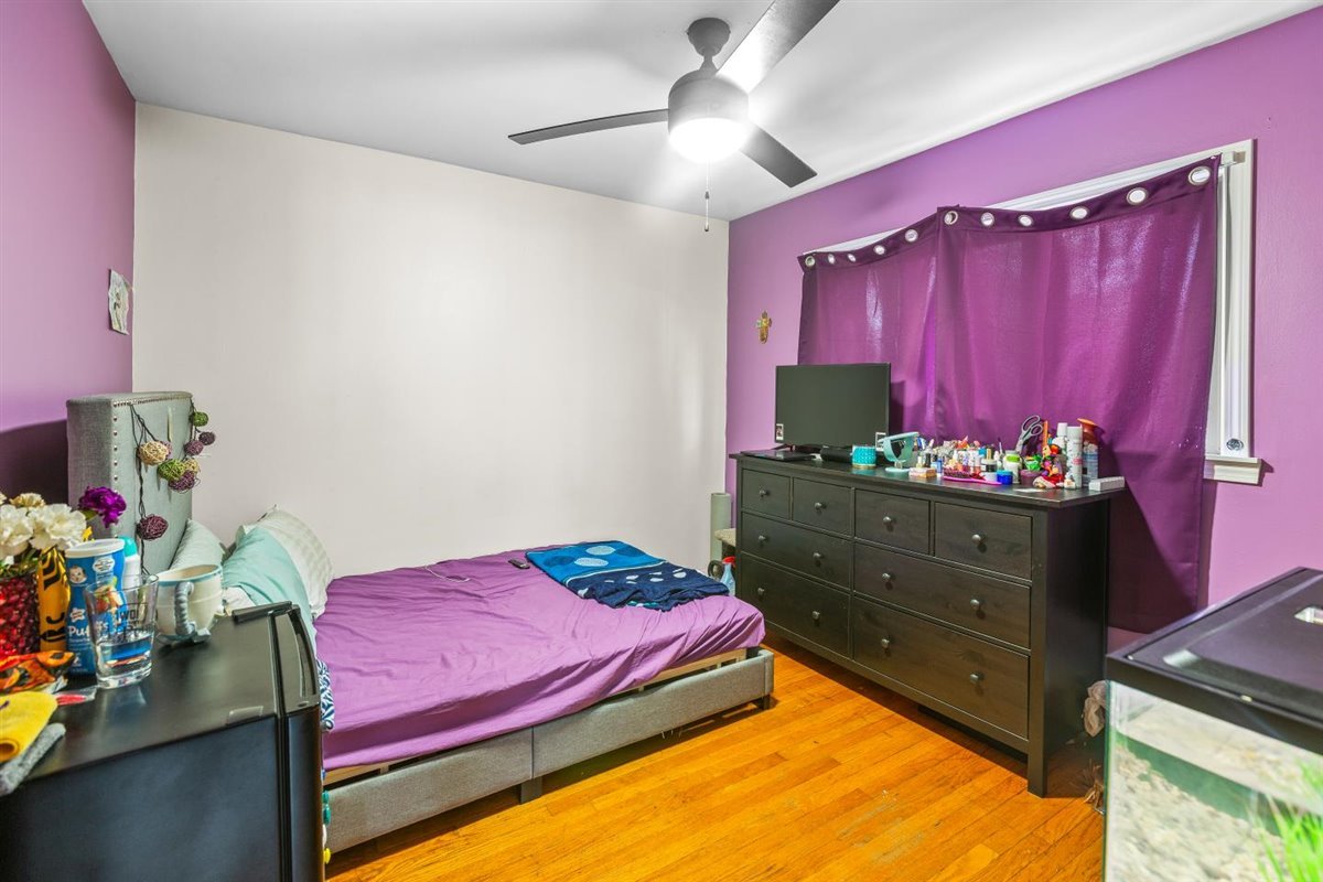 10619 Mason Avenue Chicago Ridge, IL 60415 - Photo 8 of 29 a bedroom with a bed and a dresser