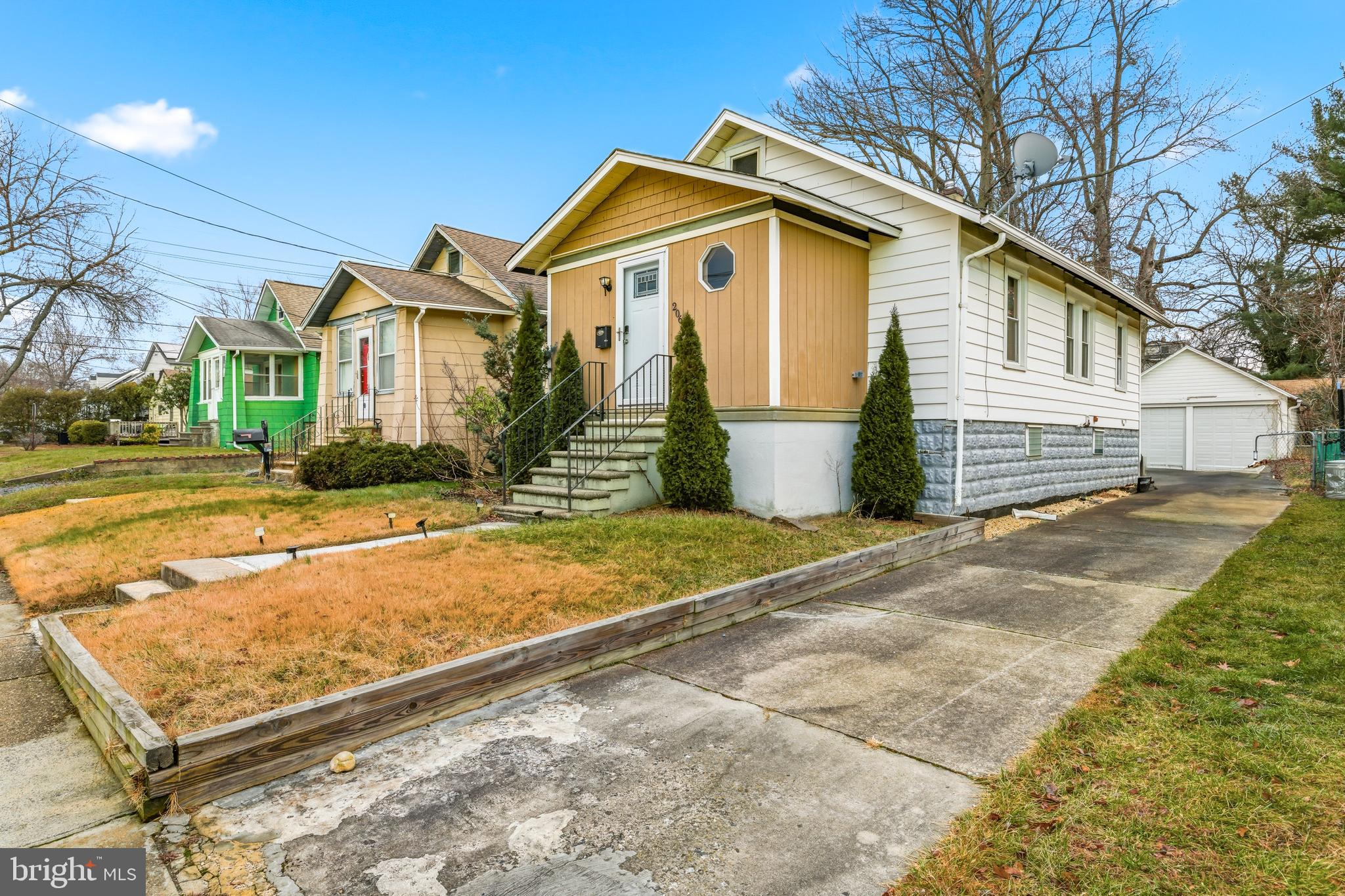 206 West 5th Avenue Runnemede, NJ 08078 - Photo 2 of 14 a front view of a house with a yard