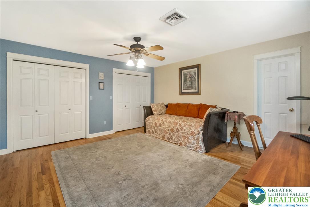1553 Surrey Road Bethlehem, PA 18015 - Photo 49 of 92 Well-appointed bedroom with warm hardwood flooring and ample closet storage.