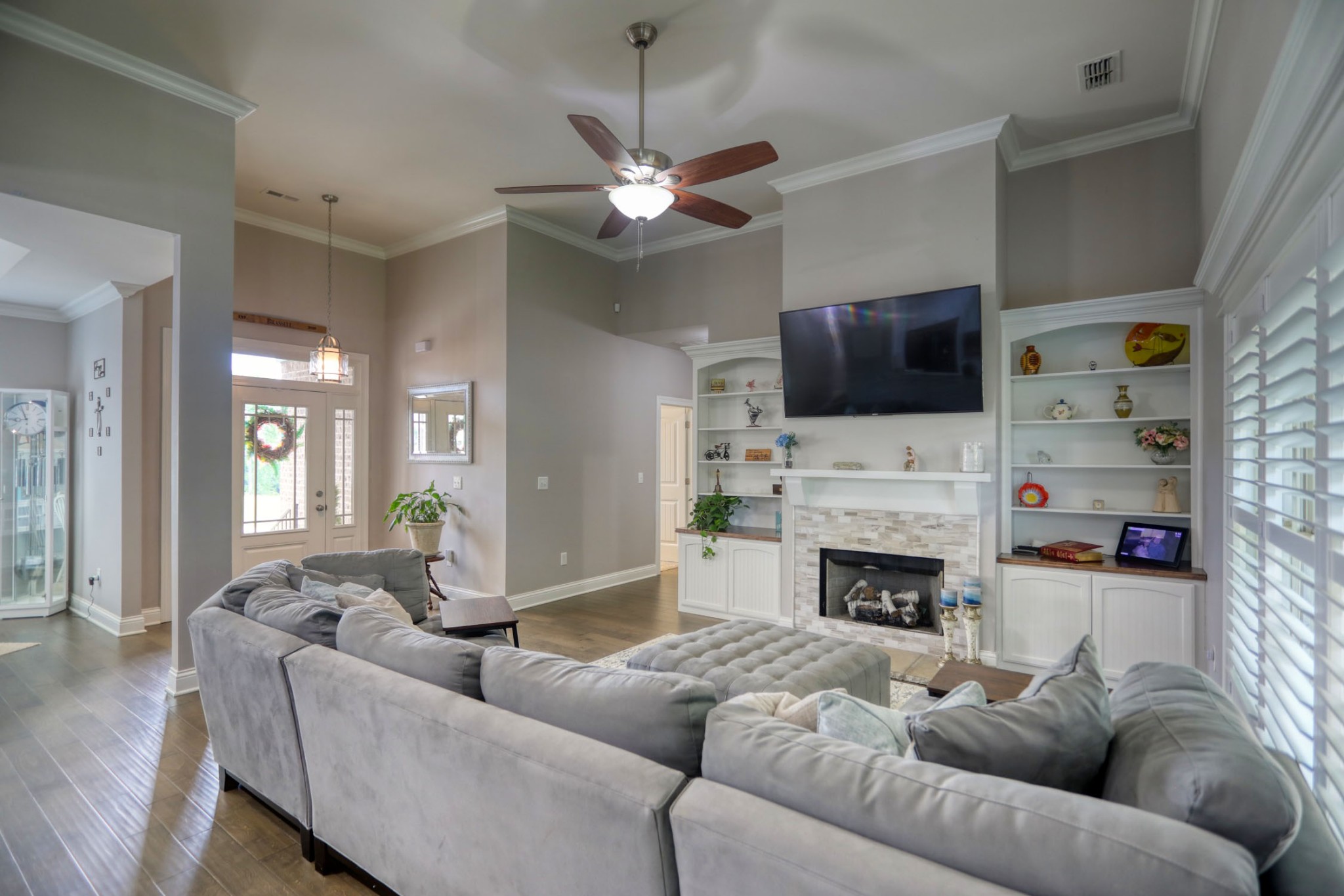 425 Tom Link Road Cottontown, TN 37048 - Photo 5 of 63 a living room with furniture a fireplace and a flat screen tv