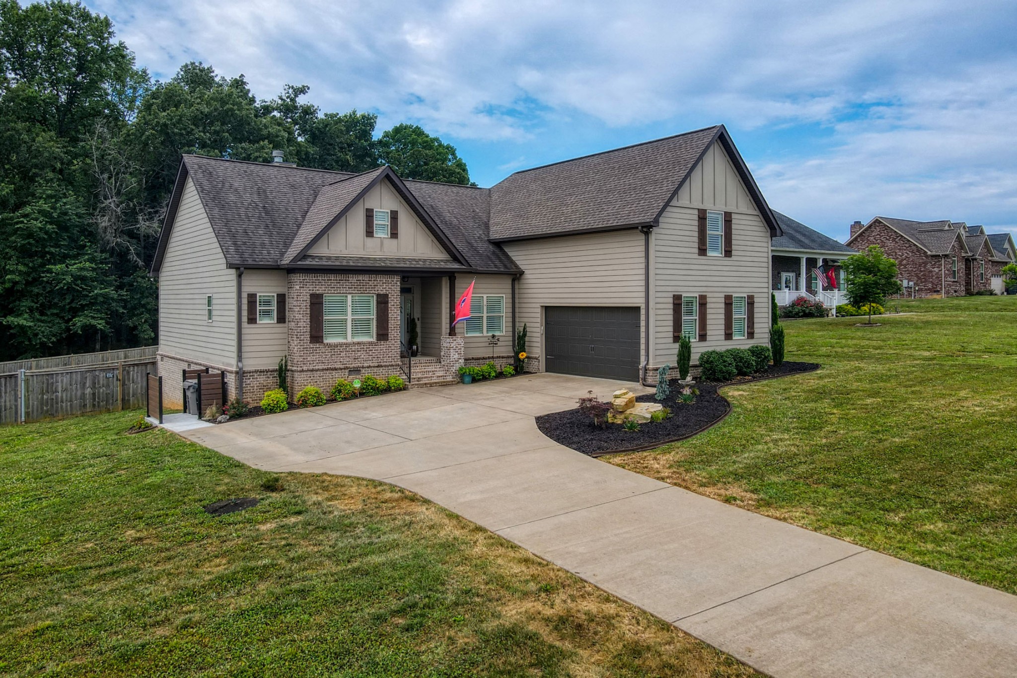 425 Tom Link Road Cottontown, TN 37048 - Photo 51 of 63 a front view of a house with garden
