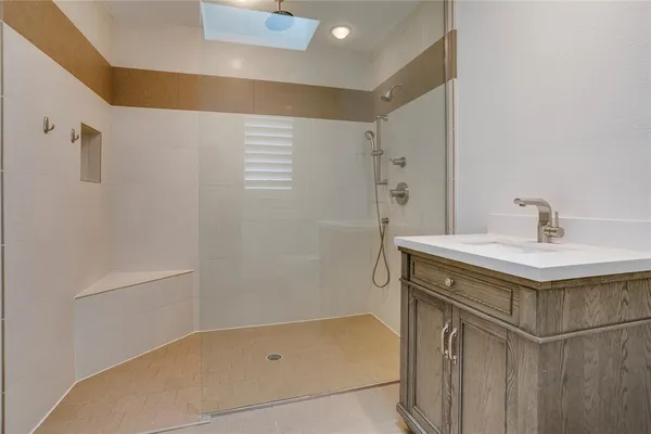 a bathroom with a sink and mirror