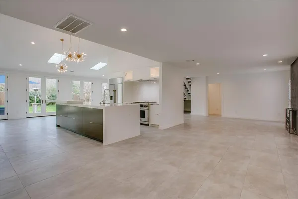 a view of a kitchen with a sink and a microwave