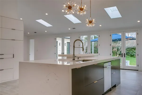 a view of a living room and kitchen