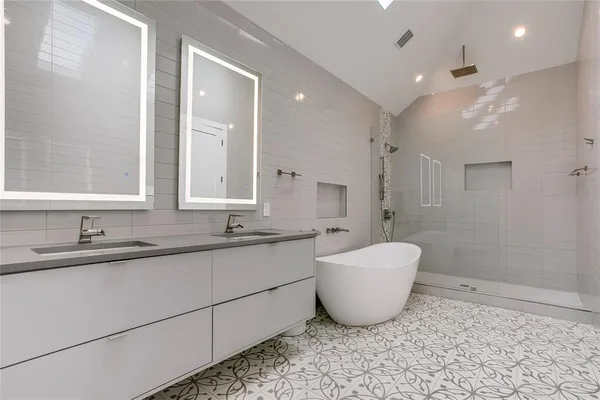 a bathroom with a sink and mirror