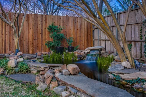 a view of a backyard with potted plants