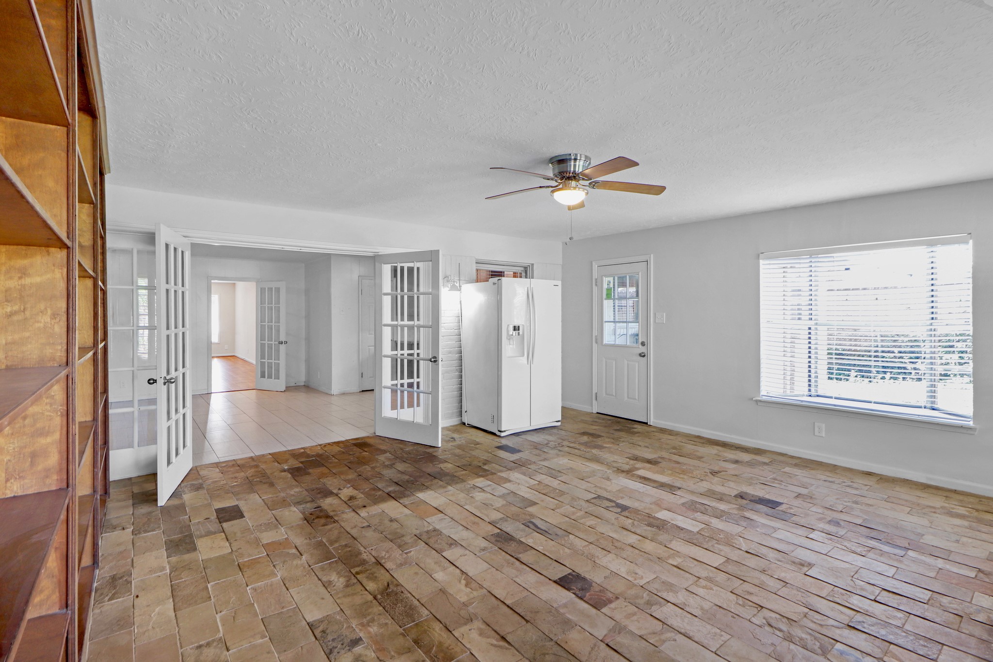 5554 Beechnut Street Houston, TX 77096 - Photo 12 of 30 a view of an empty room with a window