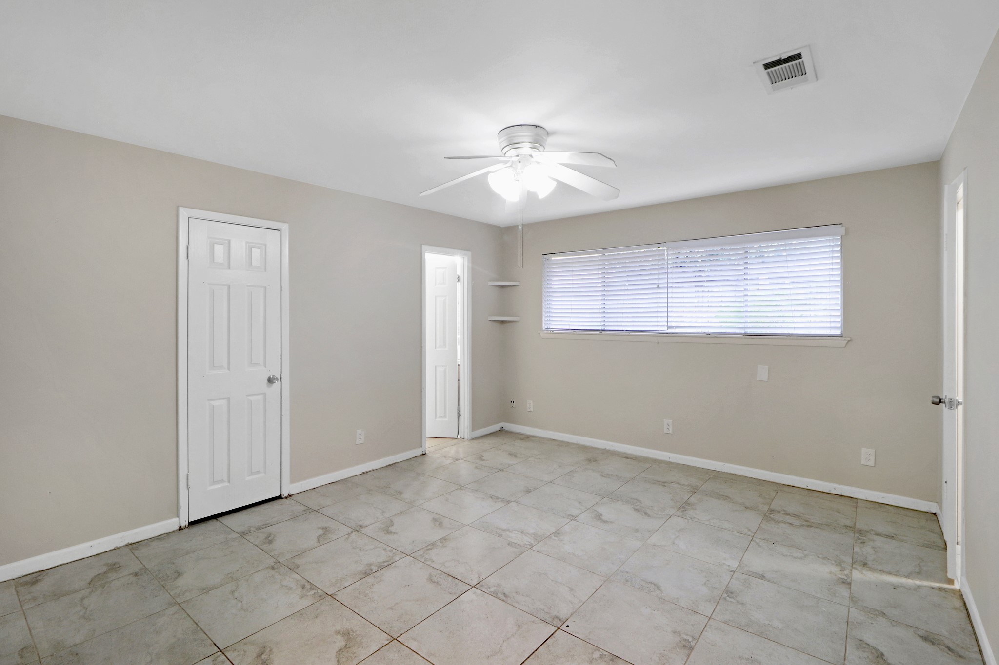5554 Beechnut Street Houston, TX 77096 - Photo 13 of 30 a view of an empty room with a window