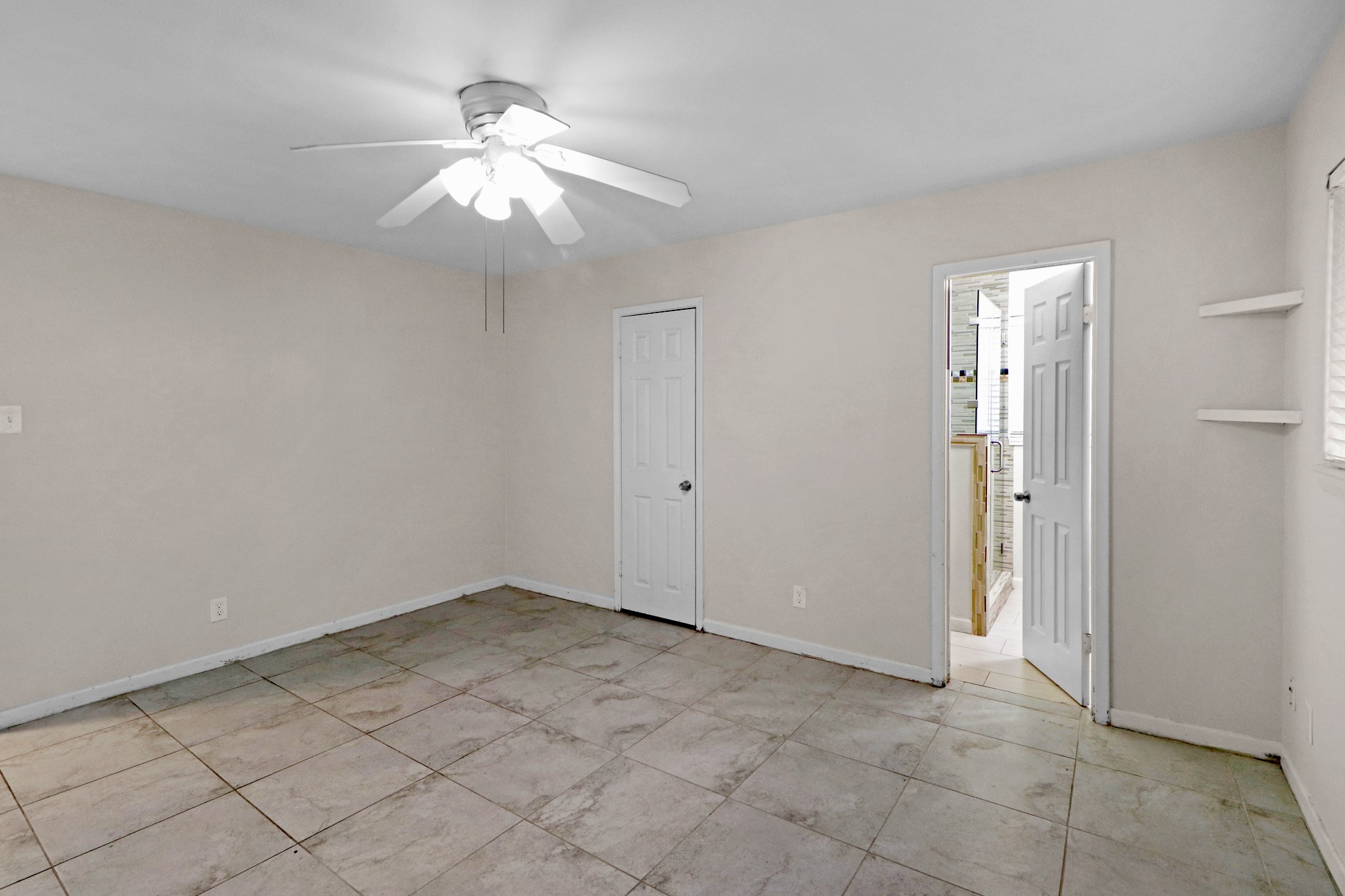 5554 Beechnut Street Houston, TX 77096 - Photo 14 of 30 a view of an empty room with window