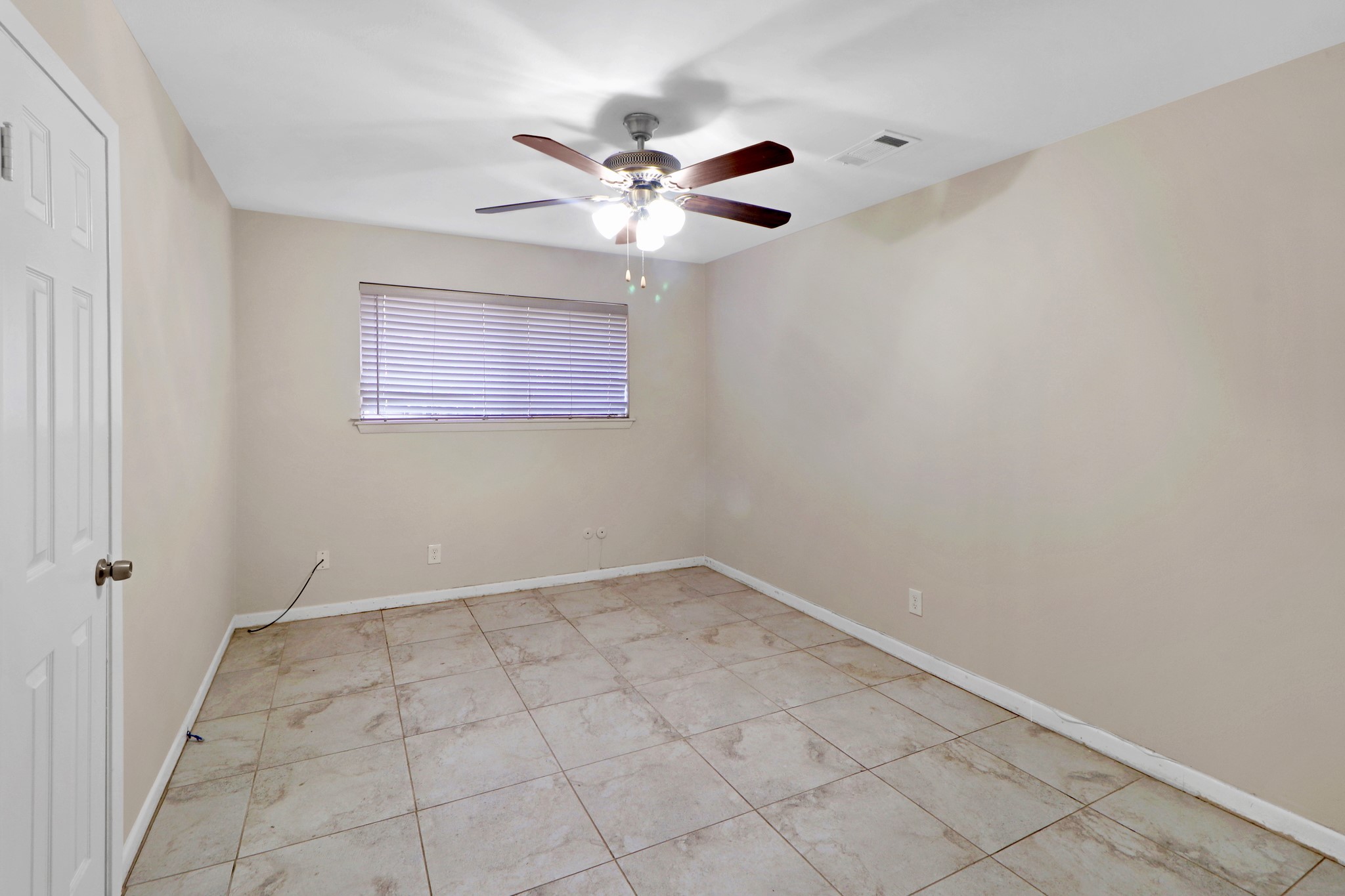 5554 Beechnut Street Houston, TX 77096 - Photo 20 of 30 a view of an empty room with a window