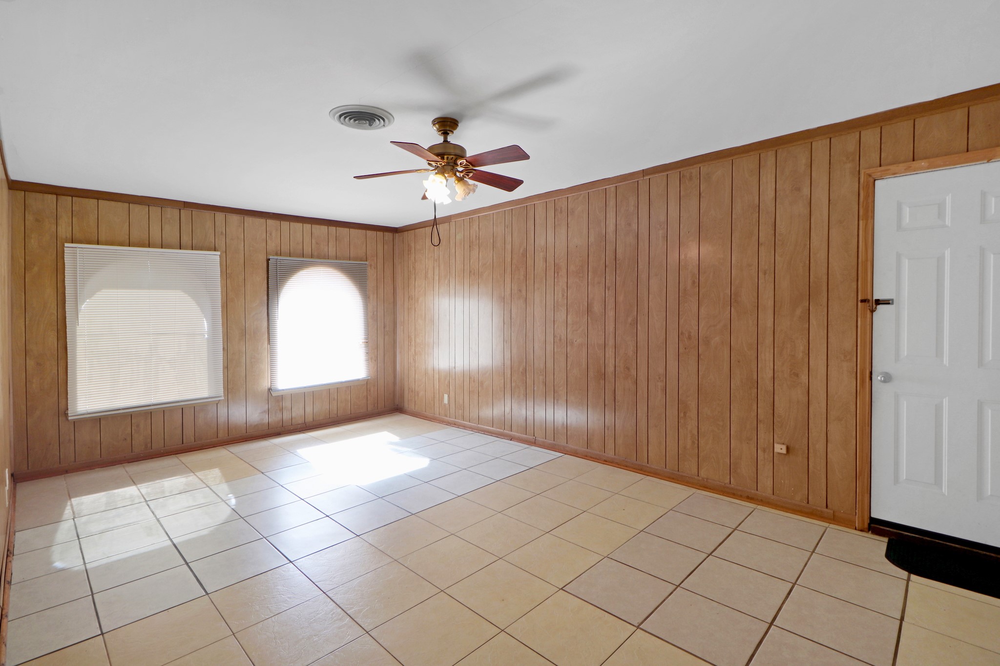 5554 Beechnut Street Houston, TX 77096 - Photo 25 of 30 a view of a big room with windows and fan