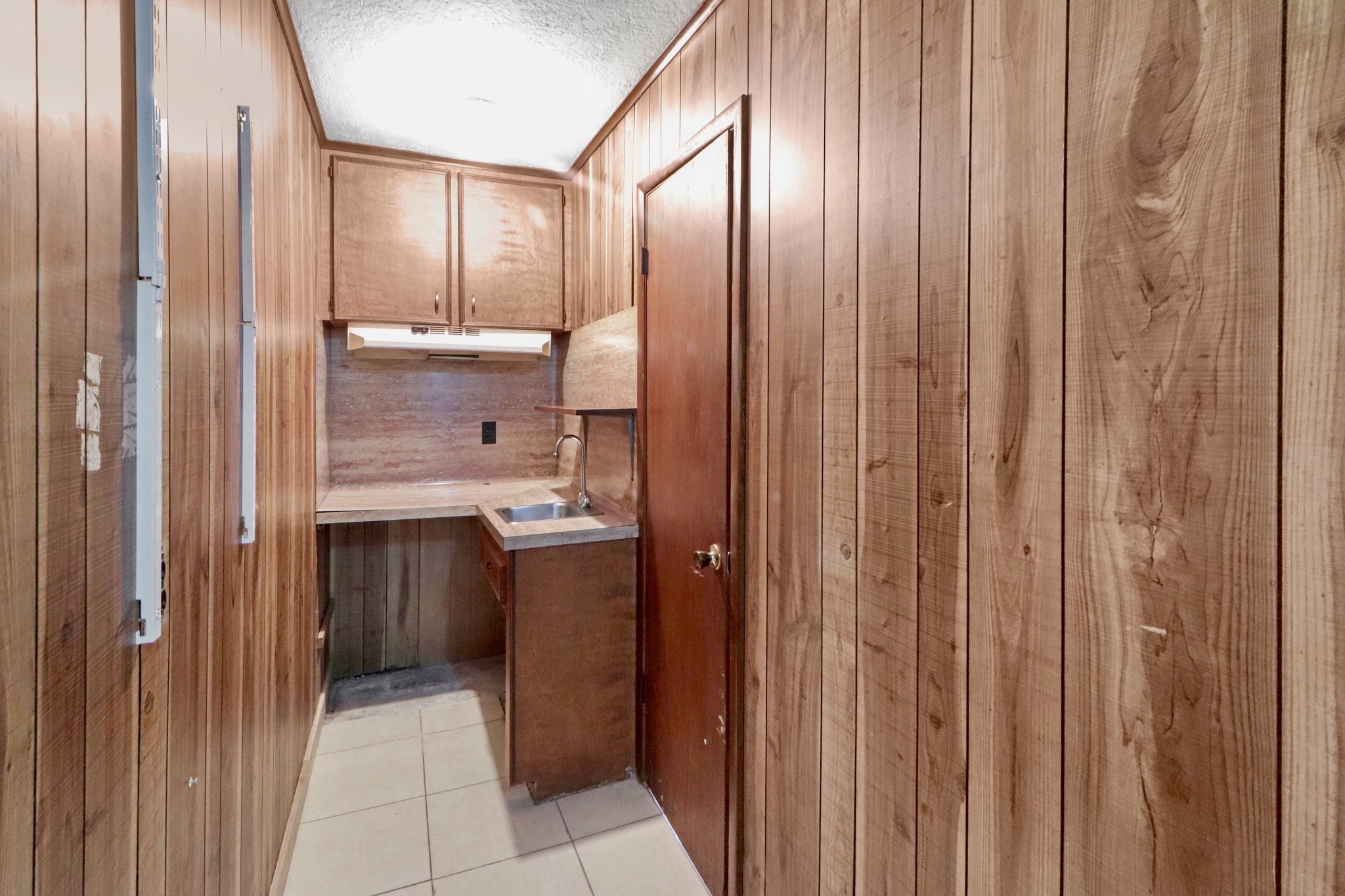5554 Beechnut Street Houston, TX 77096 - Photo 29 of 30 a bathroom with a shower and a sink