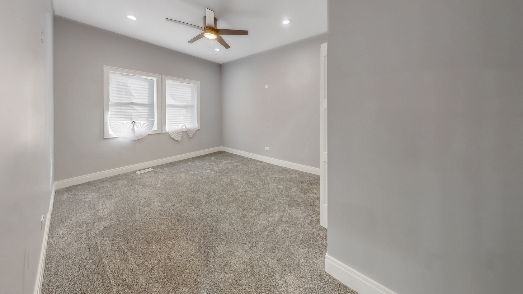 2347 Walnut Street Blue Island, IL 60406 - Photo 16 of 20 an empty room with windows and ceiling fan