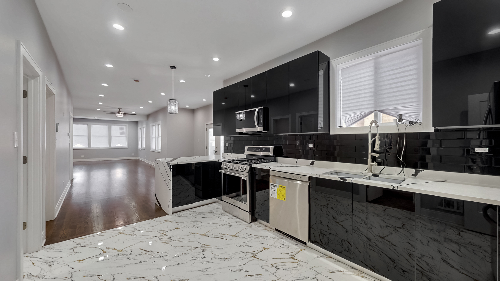 2347 Walnut Street Blue Island, IL 60406 - Photo 5 of 20 a kitchen with stainless steel appliances kitchen island granite countertop a sink and cabinets