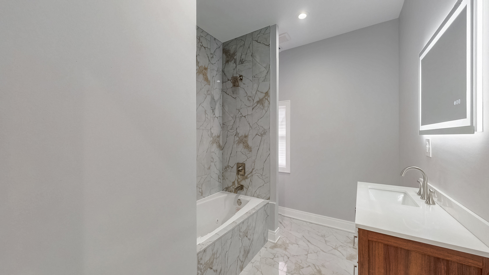 2347 Walnut Street Blue Island, IL 60406 - Photo 8 of 20 a bathroom with a tub a sink and a shower