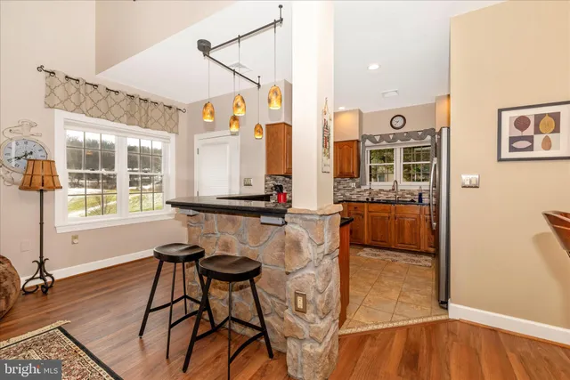 a kitchen with stainless steel appliances granite countertop a sink and cabinets