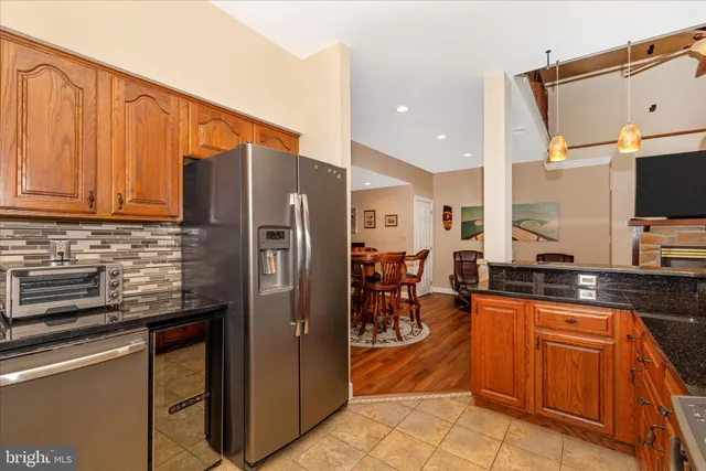 a view of a hallway with a table and a mirror