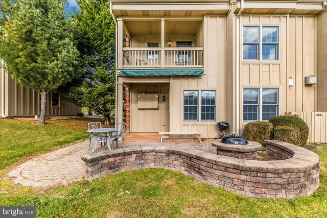 a house view with swimming pool and sitting space