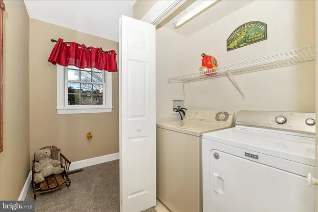 an aerial view of residential houses with outdoor space and river