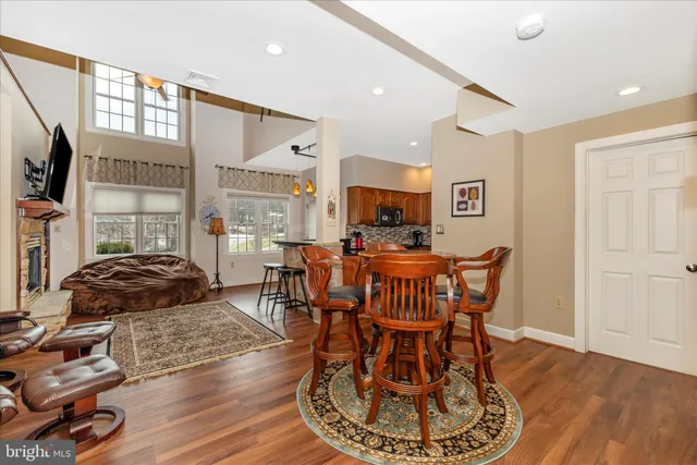 a view of a dining room with furniture and wooden floor