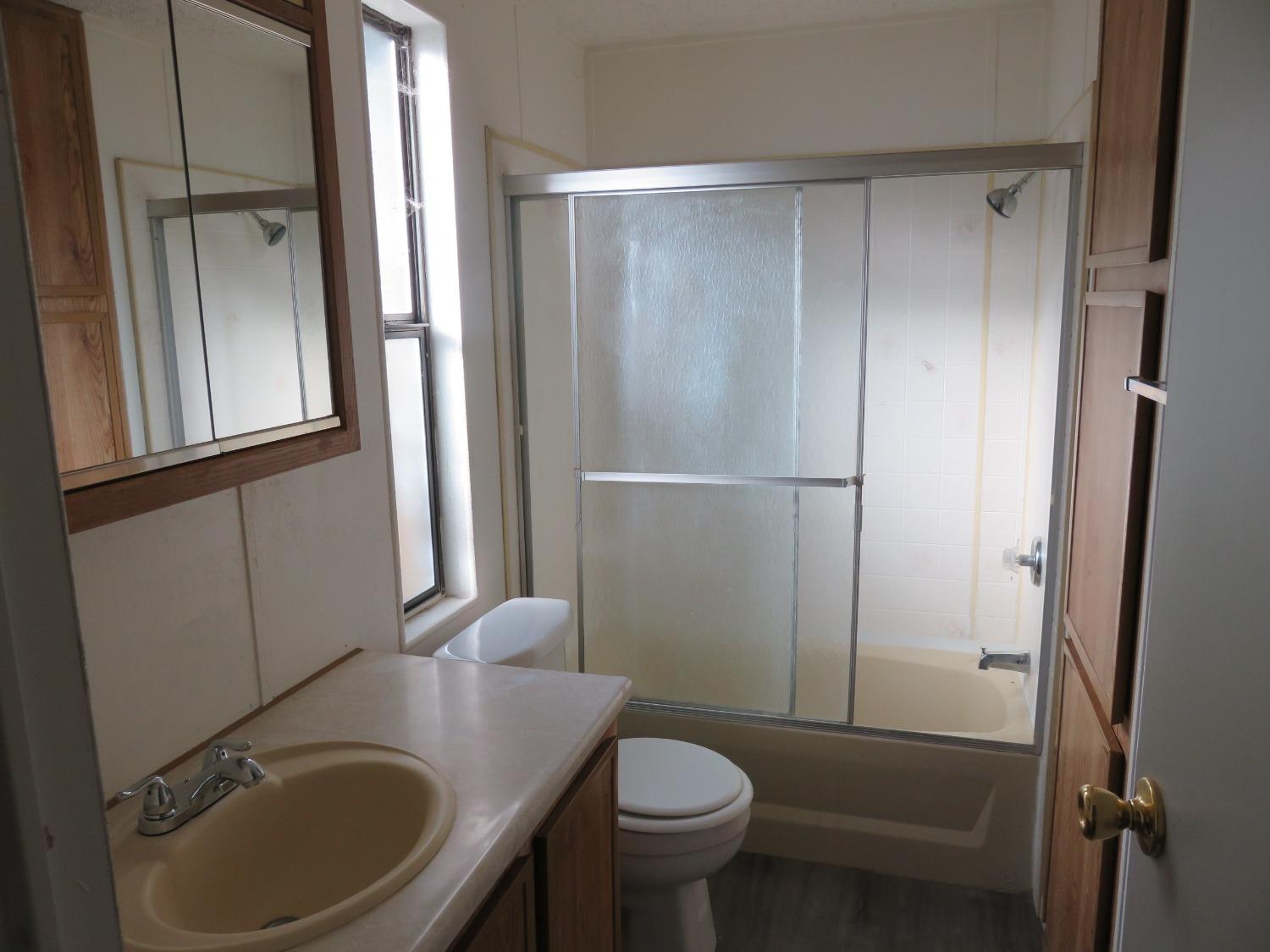 4426 Bald Mountain Road West Point, CA 95255 - Photo 30 of 45 a bathroom with a sink a toilet and shower