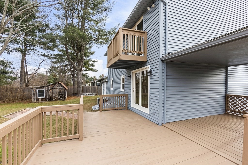 32 Elaine Street Webster, MA 01570 - Photo 12 of 42 a view of a house with a wooden fence