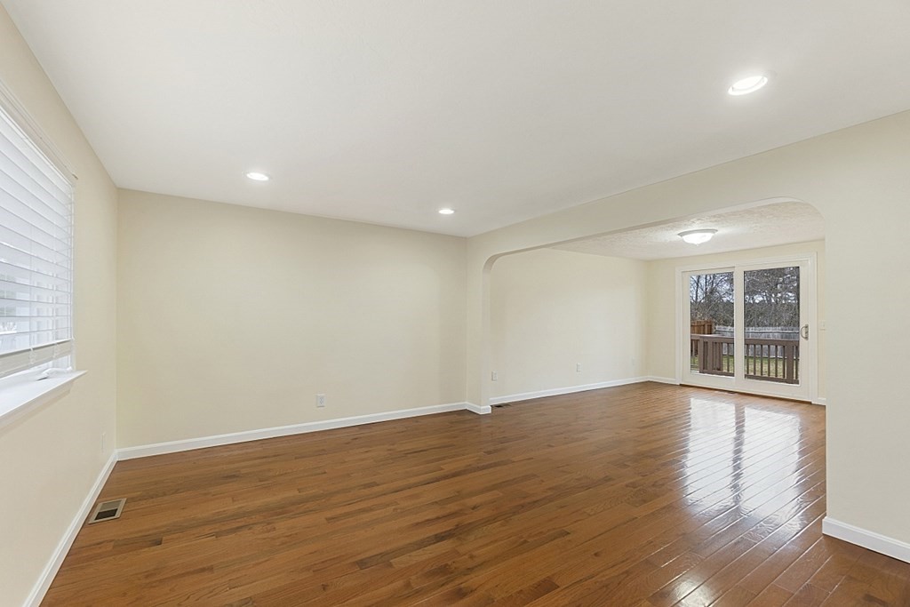 32 Elaine Street Webster, MA 01570 - Photo 13 of 42 a view of an empty room with wooden floor and windows