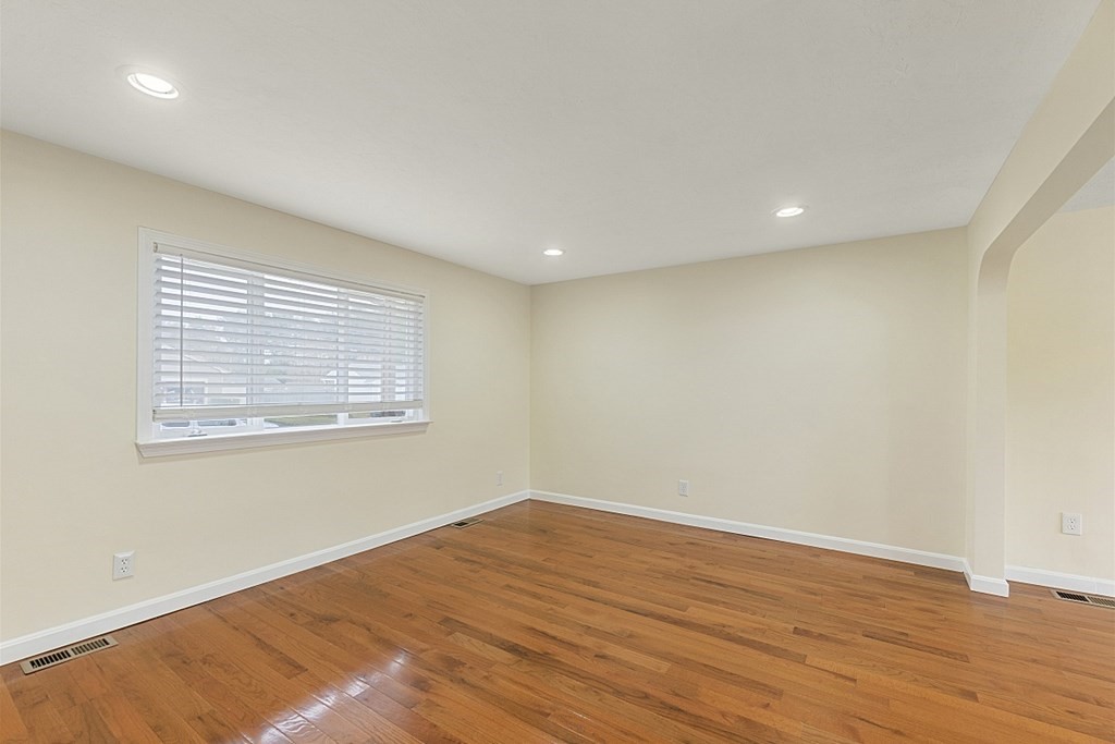 32 Elaine Street Webster, MA 01570 - Photo 14 of 42 an empty room with wooden floor and windows