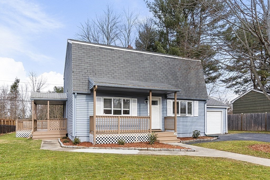 32 Elaine Street Webster, MA 01570 - Photo 2 of 42 a front view of a house with a garden
