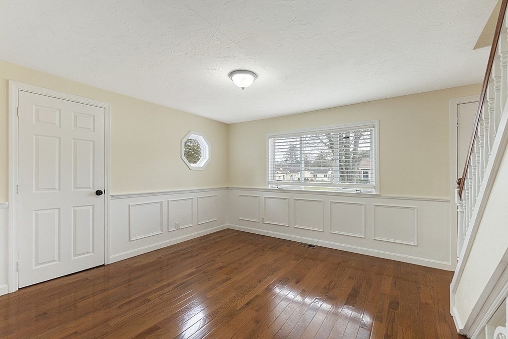 32 Elaine Street Webster, MA 01570 - Photo 23 of 42 an empty room with wooden floor and windows