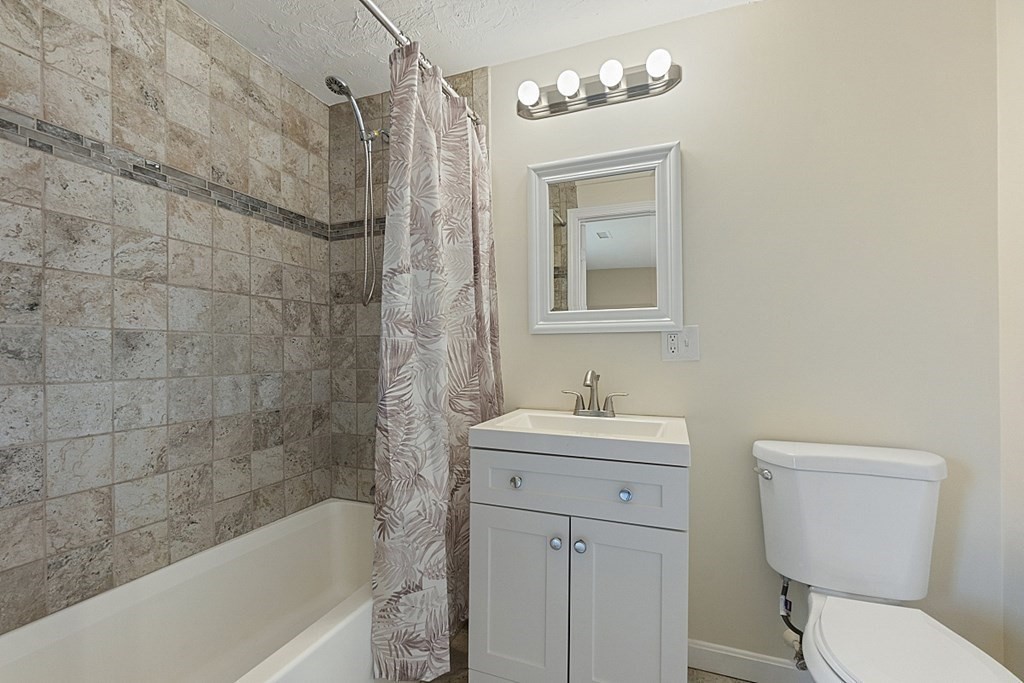 32 Elaine Street Webster, MA 01570 - Photo 34 of 42 a bathroom with a sink a toilet and shower