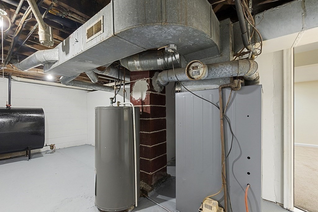 32 Elaine Street Webster, MA 01570 - Photo 41 of 42 a view of storage and utility room with racks on the wall