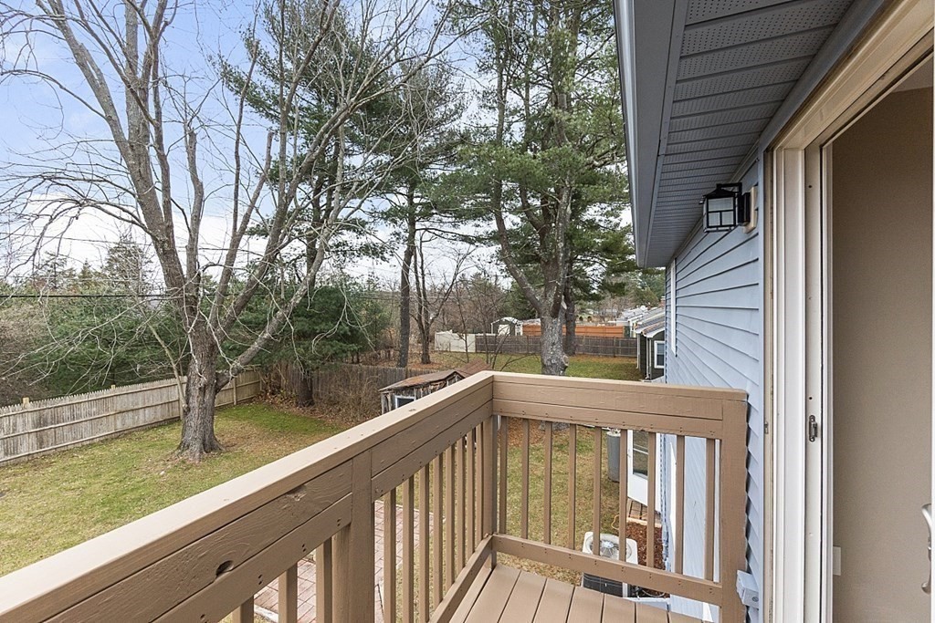 32 Elaine Street Webster, MA 01570 - Photo 5 of 42 a view of a wooden deck with trees